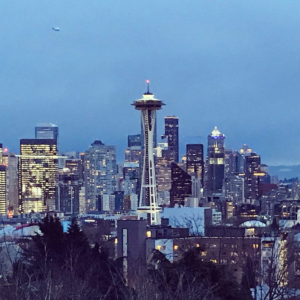Seattle skyline at dusk with the Space Needle at the center.