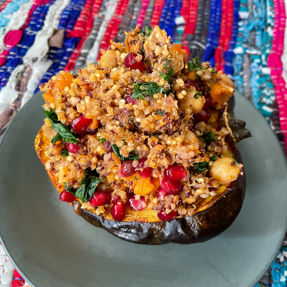 A side view of the stuffed acorn squash, with the quinoa stuffing piled high.